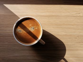 Directly above shot of coffee cup on table