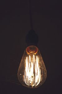 Close-up of illuminated light bulb