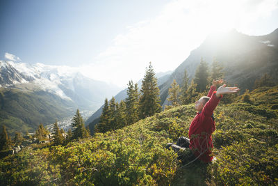 Female hiker relaxing at mountains