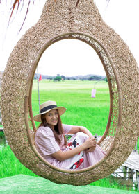 Portrait of woman sitting on grass