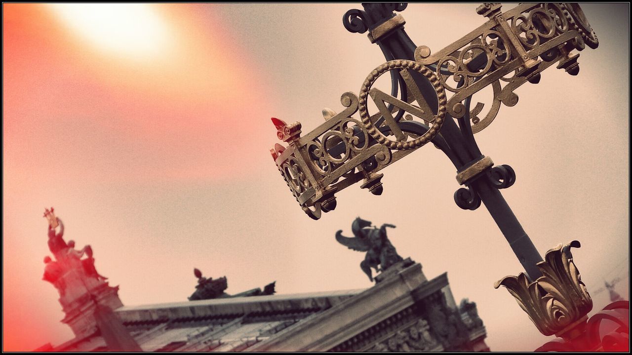 low angle view, statue, sculpture, architecture, built structure, famous place, art and craft, human representation, art, international landmark, travel destinations, creativity, building exterior, tourism, sky, travel, capital cities, religion, history