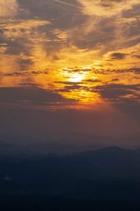 Scenic view of dramatic sky during sunset