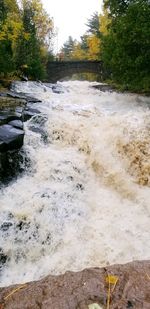 Scenic view of river flowing through rocks