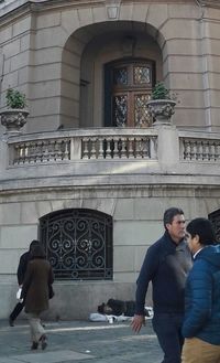 Woman standing in front of building