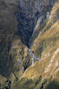 Long-distance view of devil's punchbowl waterfall, arthur's pass, new zealand