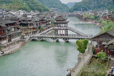 High angle view of bridge over river in town