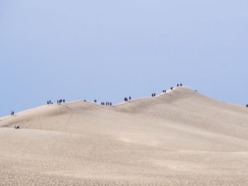 Scenic view of dune of pilat in france against clear sky