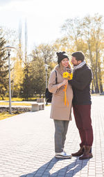 Man and woman standing outdoors