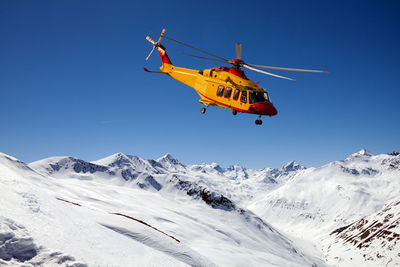 Scenic view of snowcapped mountains against clear sky