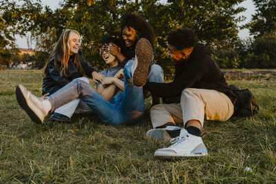Young couple sitting on grass