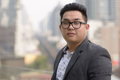 Portrait of young man standing outdoors