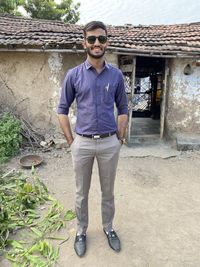 Portrait of young man standing outdoors