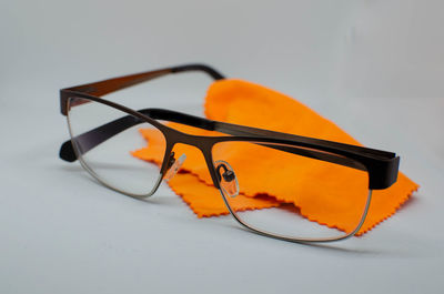 Close-up of sunglasses on table against white background