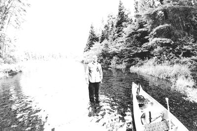 Reflection of woman on tree against sky