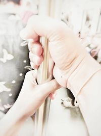 Midsection of woman holding hands