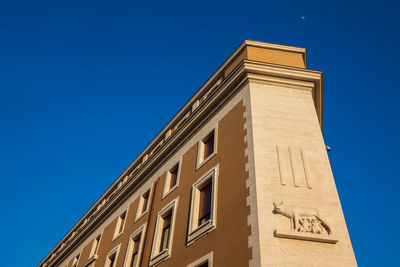 Low angle view of building against clear blue sky