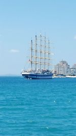 Ship sailing on sea against sky