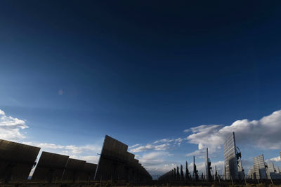 Low angle view of buildings against blue sky