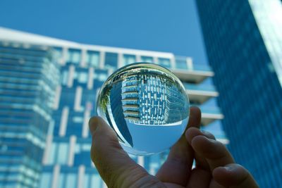 Cropped hand holding crystal ball