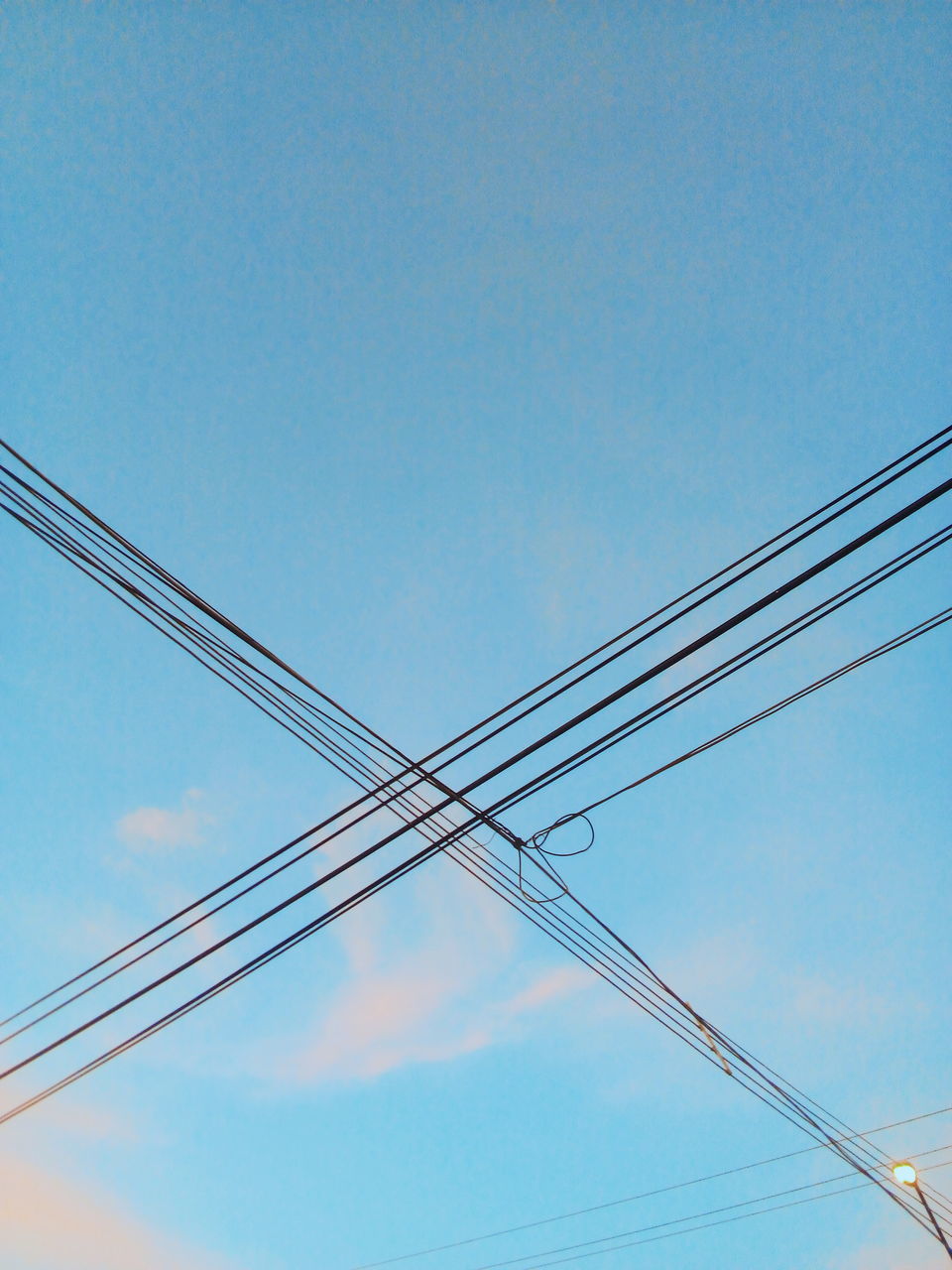 cable, sky, low angle view, electricity, power supply, connection, power line, blue, no people, technology, fuel and power generation, day, copy space, nature, clear sky, electricity pylon, outdoors, complexity, power cable, electrical equipment, telephone line, directly below, parallel