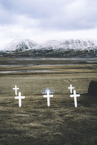 Scenic view of field against sky during winter