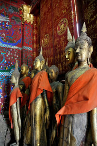 Statue of buddha against building