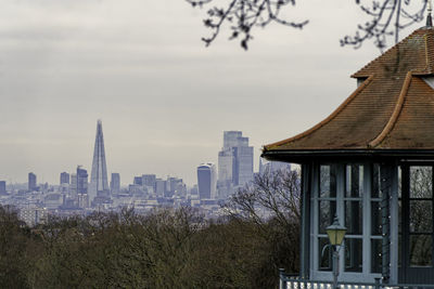 Buildings in city against sky