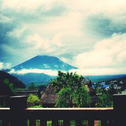 Scenic view of mountains against cloudy sky