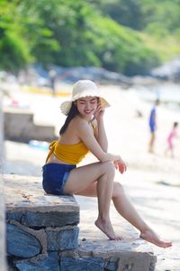 Portrait of smiling girl sitting outdoors