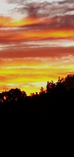 Scenic view of dramatic sky during sunset