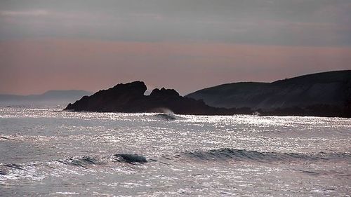 Scenic view of sea at sunset