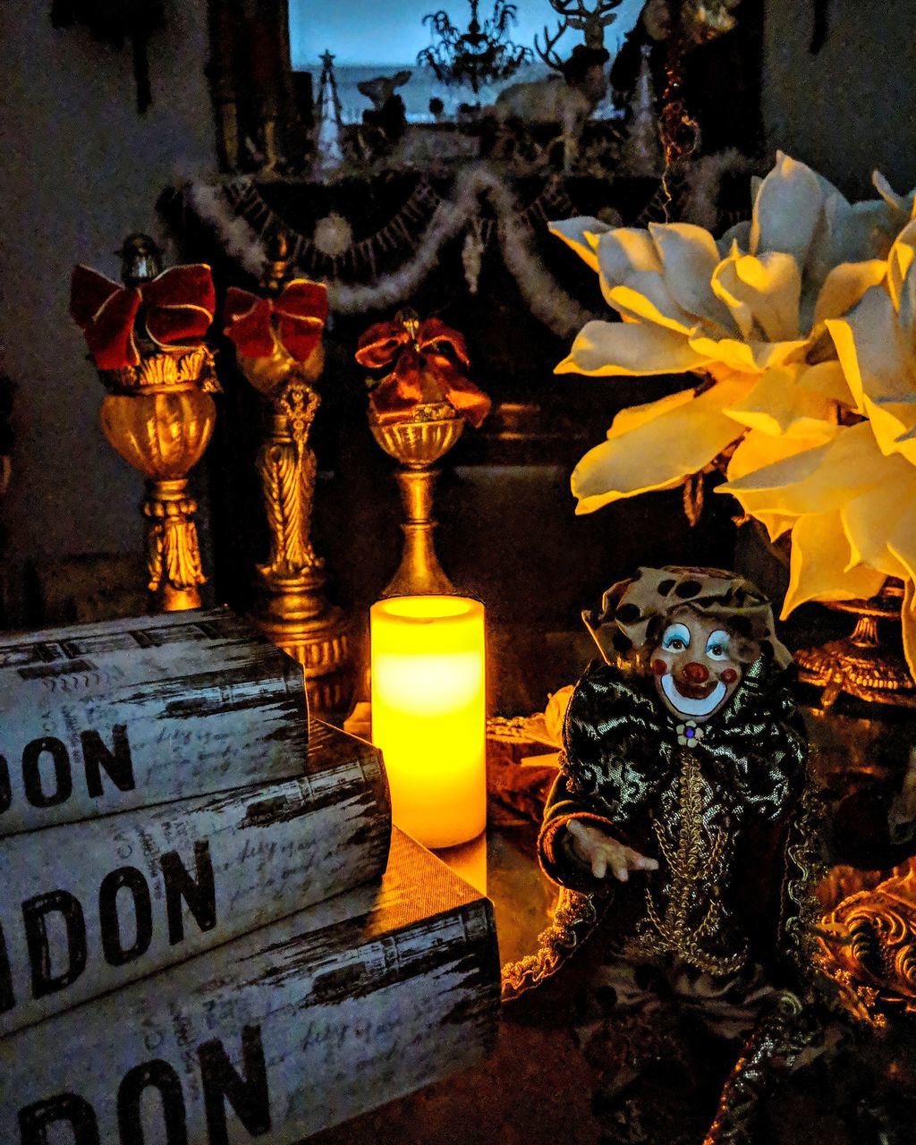 CLOSE-UP OF STATUE OF ILLUMINATED CANDLES