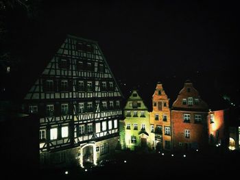 View of buildings in city at night