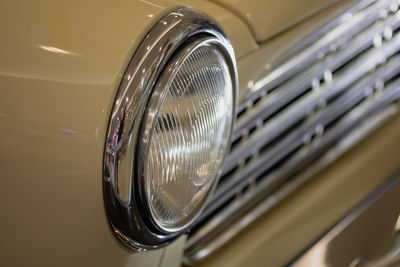 Close-up of vintage car headlight