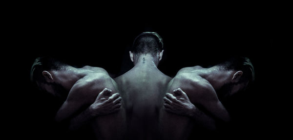 Midsection of man against black background