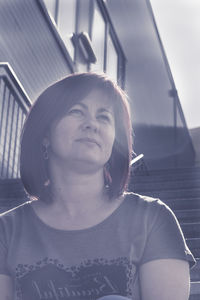 Close-up of smiling woman looking away