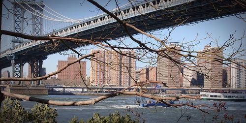 Bridge over city against sky