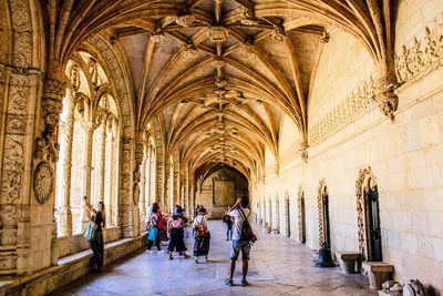 People in corridor of temple