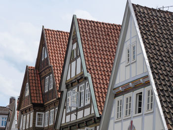 Low angle view of buildings in city against sky