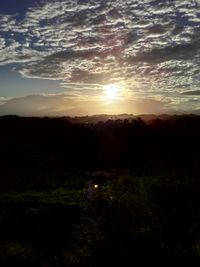 Scenic view of silhouette landscape against sky during sunset