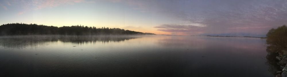 Scenic view of lake at sunset