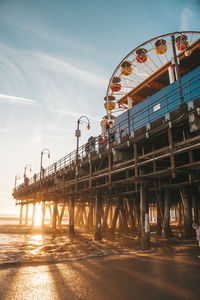 Low angle view of ferris wheel against sky at santa monica pier