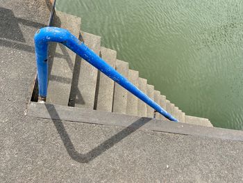 High angle view of ropes on railing