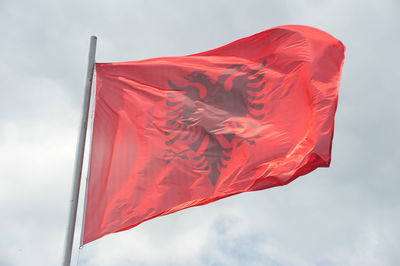 Low angle view of albania flag against sky