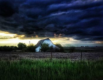 Scenic view of landscape against cloudy sky