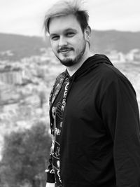 Portrait of young man standing outdoors