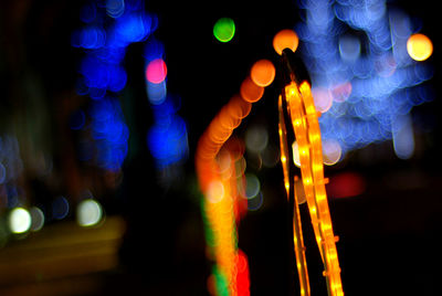 Defocused image of illuminated lights at night