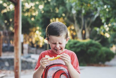 Portrait of boy eating food