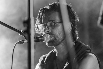 Close-up portrait of man wearing eyeglasses