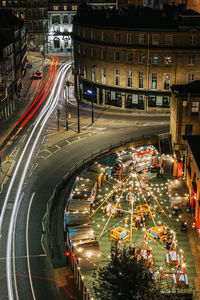 High angle view of light trails on road in city